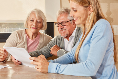 Daughter helps couple of seniors in retirement home with insurance and pension